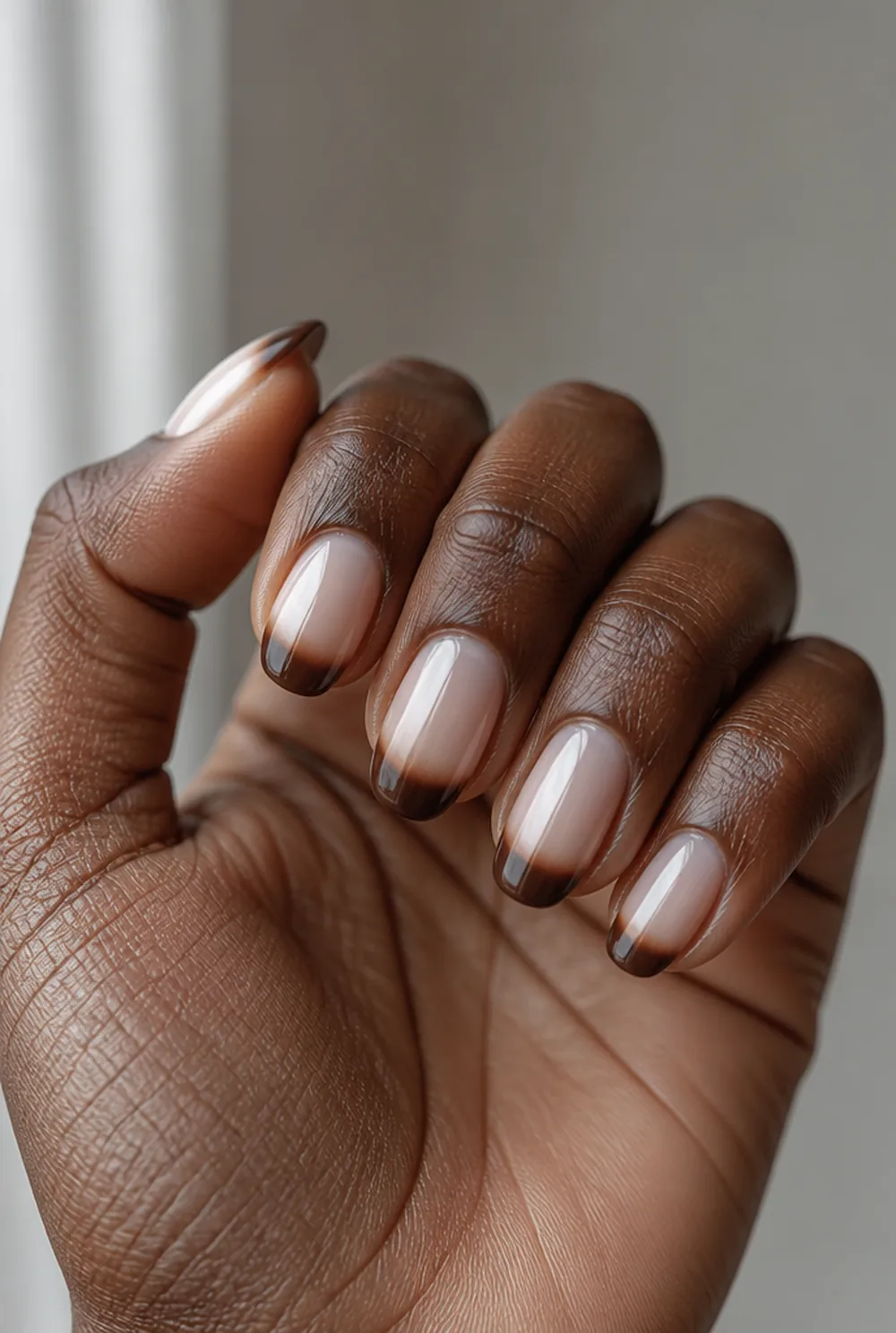 chocolate brown tips nail art on deep brown skin