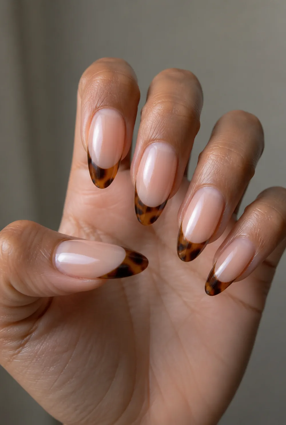 tortoise tips nail art on olive skin, long length