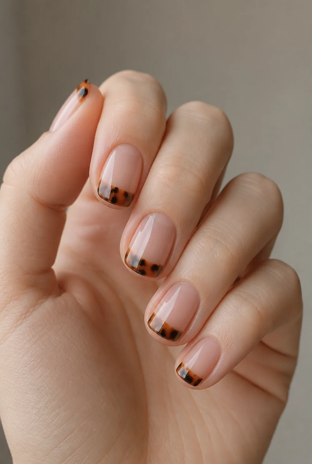 tortoise tips nail art on fair skin, short length