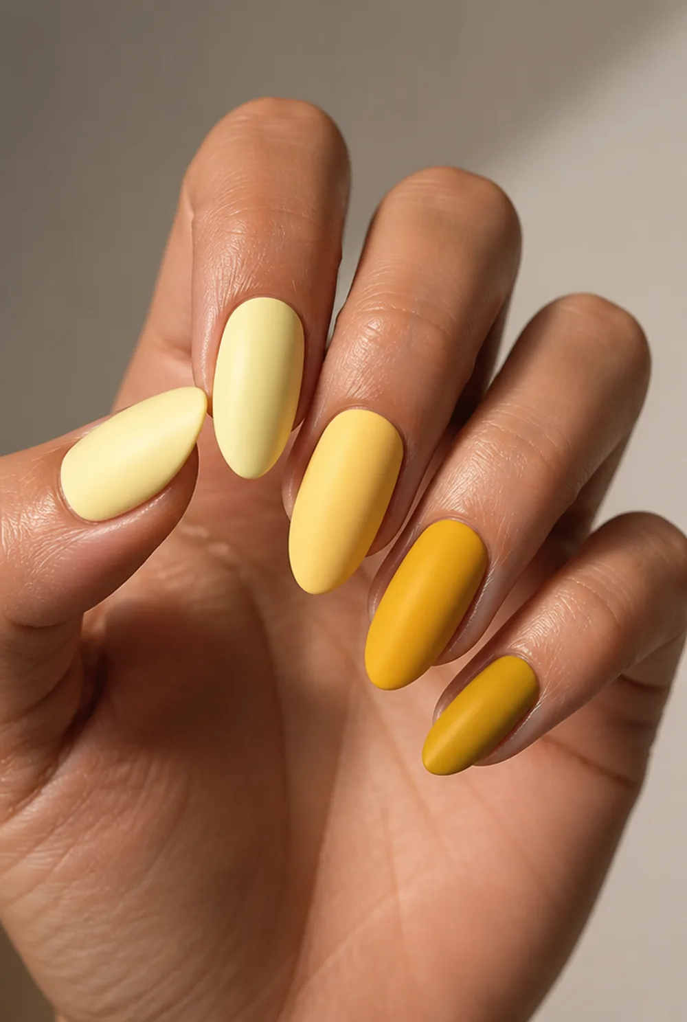 butter yellow melting into mustard nail art on olive skin, long length