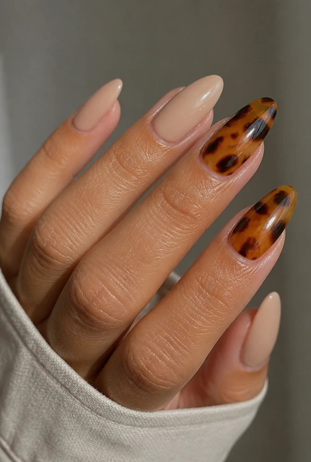 tortoiseshell accents nail art on olive skin, long length