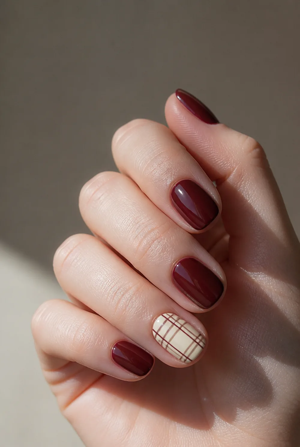 plaid accent nail nail art on fair skin, short length
