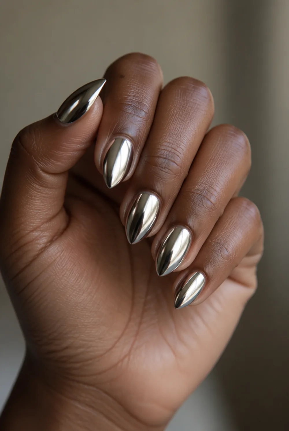 stiletto chrome nail art on deep brown skin - PolishedAndPrettyNails.com stiletto chrome nail art on deep brown skin