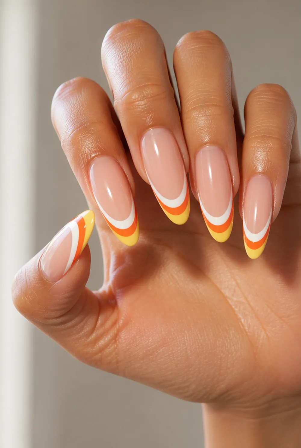 candy corn tips nail art on olive skin, long length