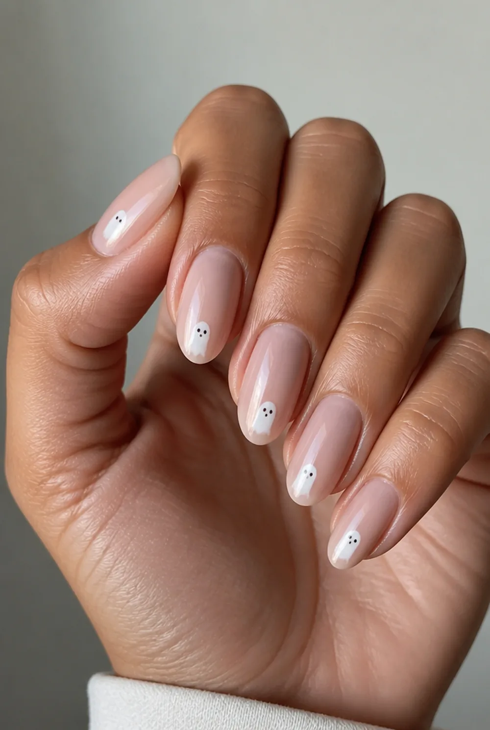 minimal ghosts nail art on olive skin, long length