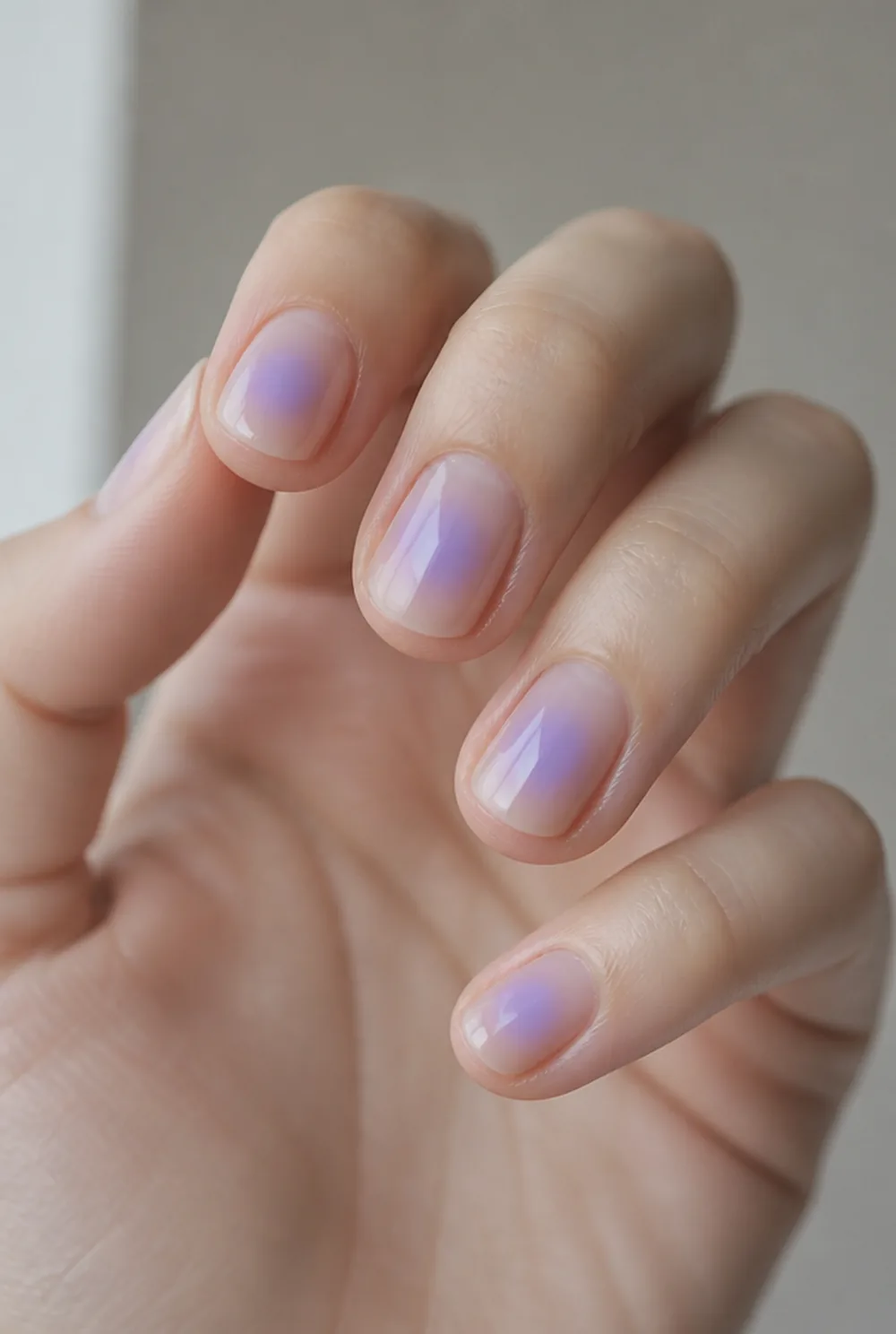 sheer aura wash nail art on fair skin, short length