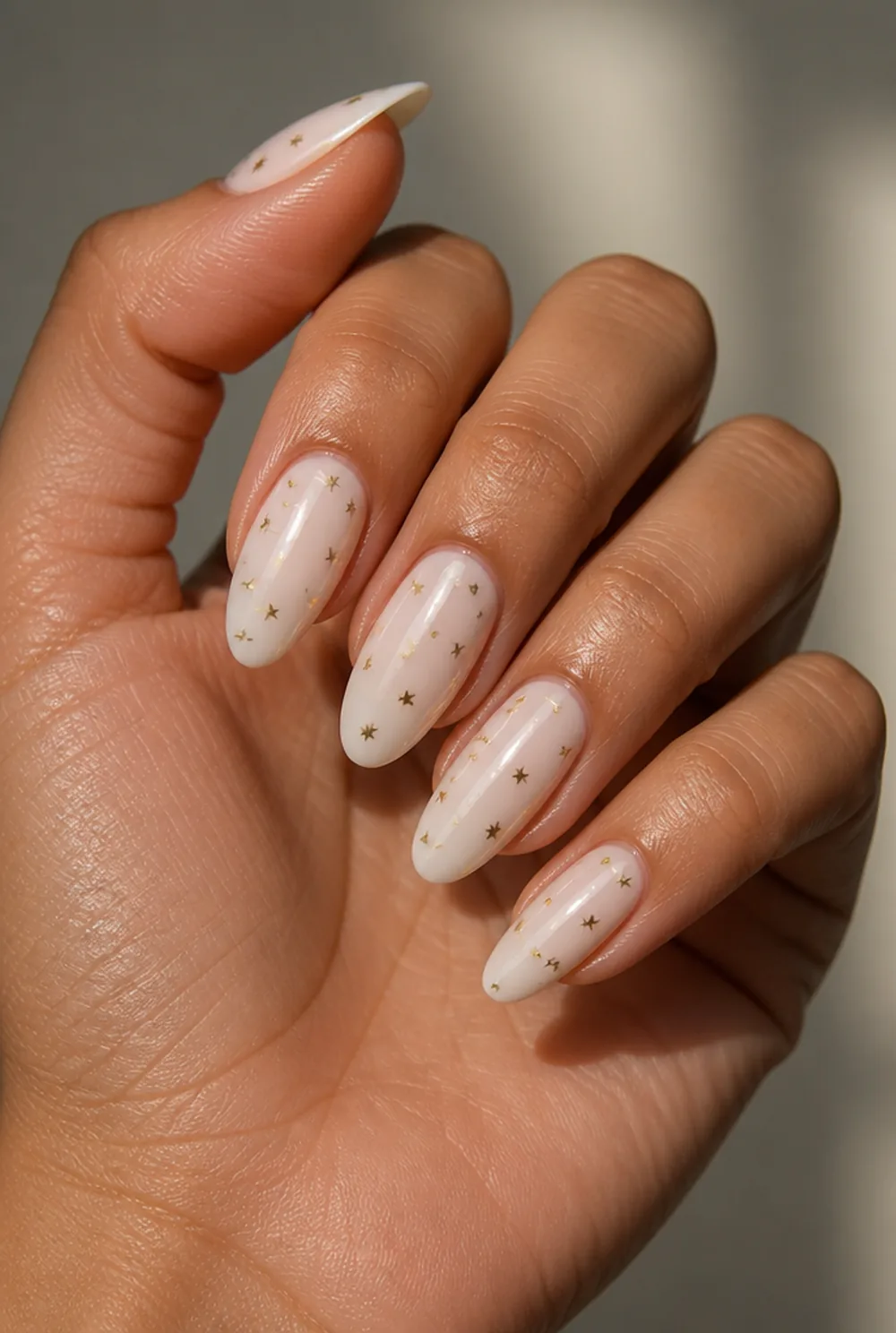 tiny stars nail art on olive skin, long length