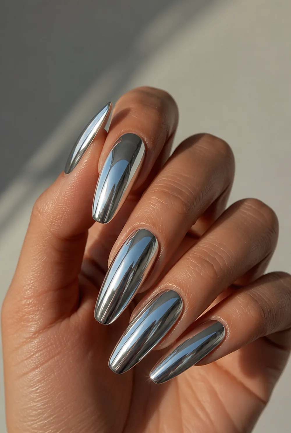 full mirror chrome nail art on olive skin, long length