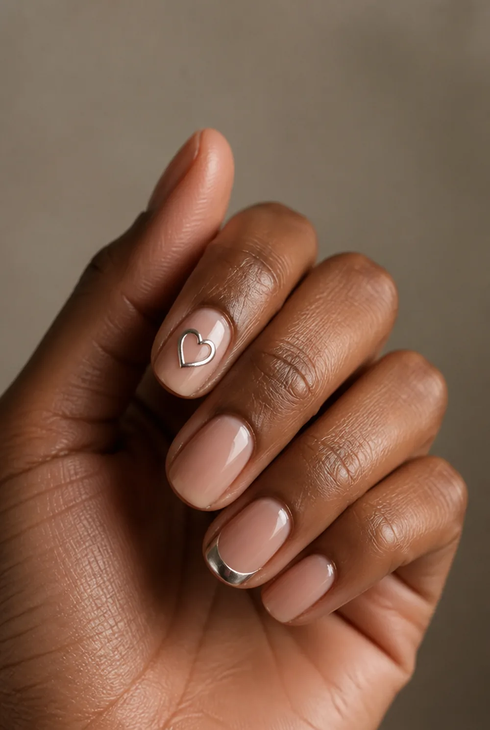 chrome detail accents nail art on deep brown skin
