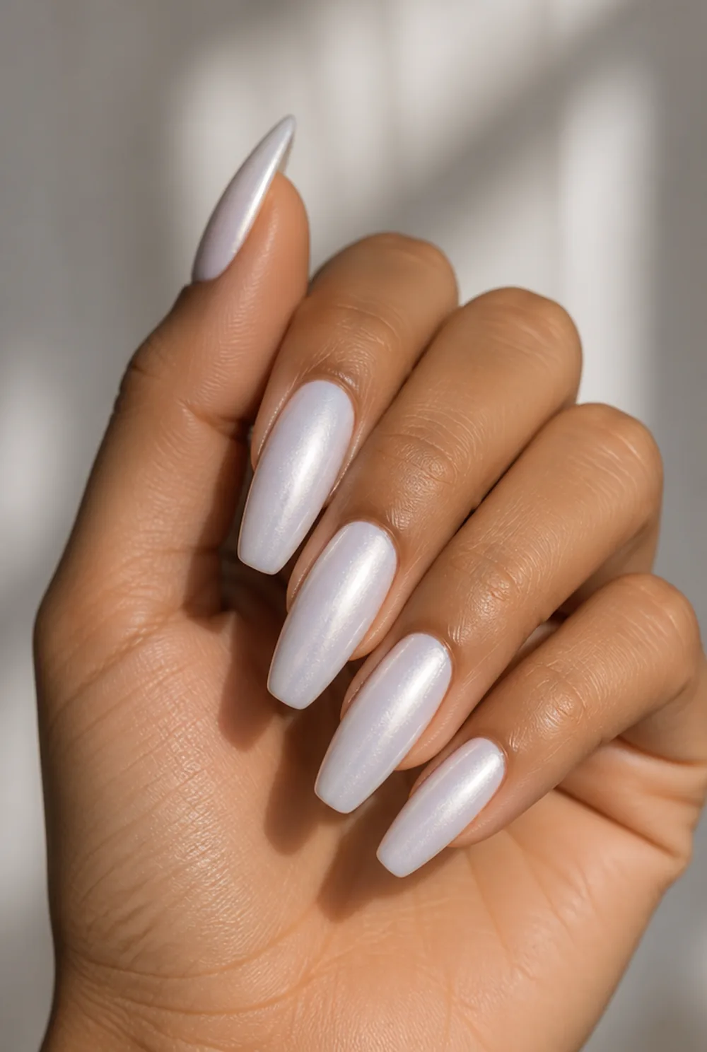 pearl glaze nail art on olive skin, long length