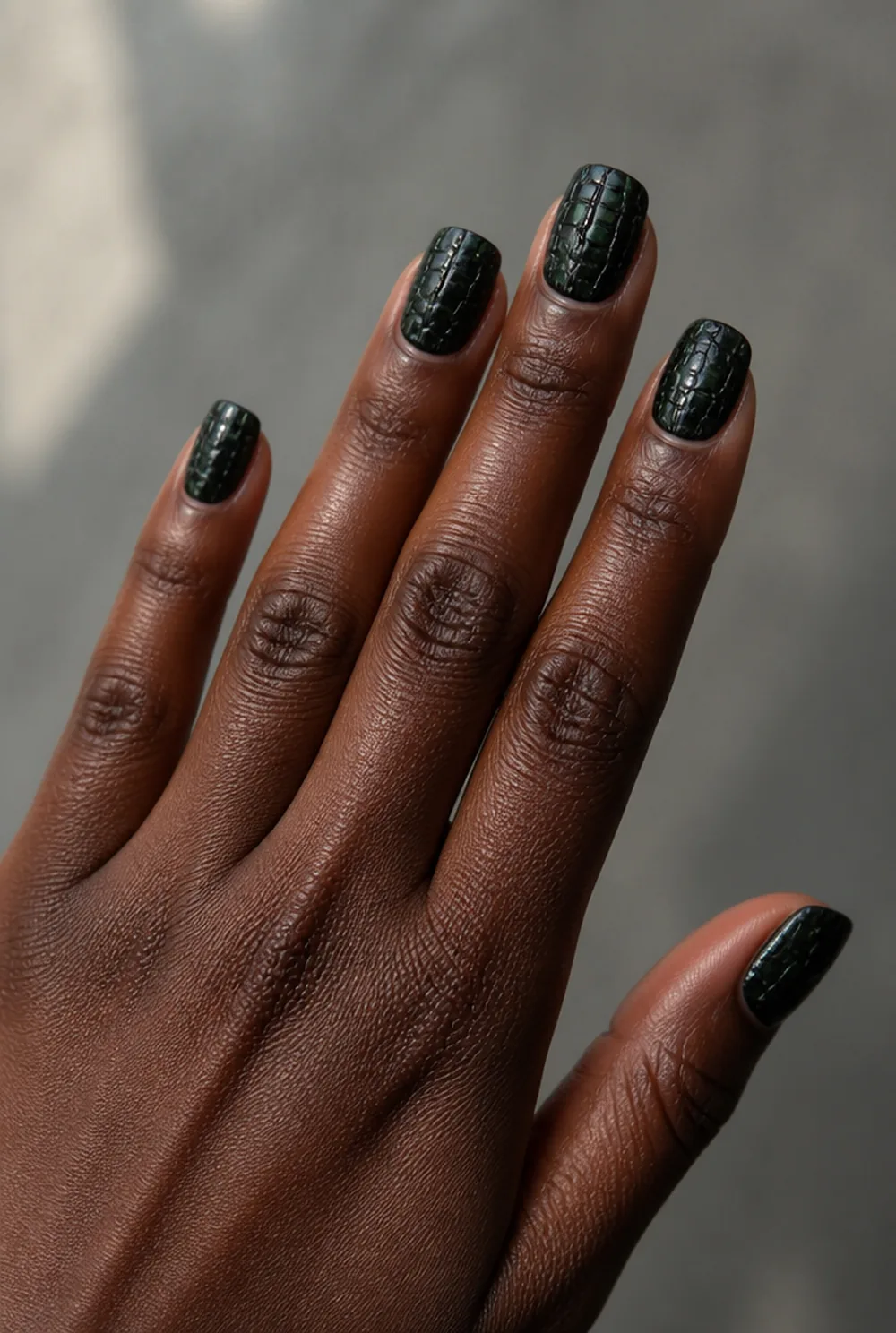 croc texture nail art on deep brown skin