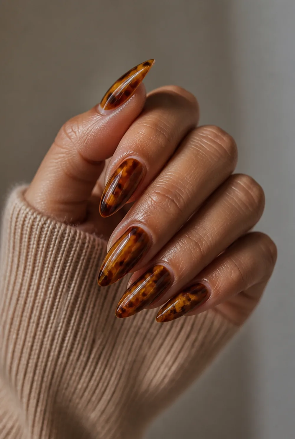 tortoise shell nail art on olive skin, long length