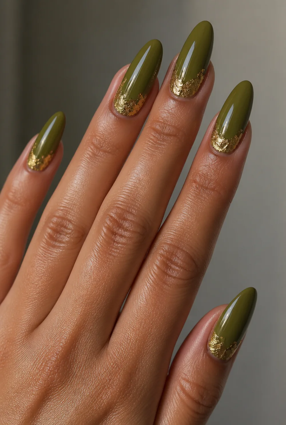 olive and gold leaf nail art on olive skin, long length