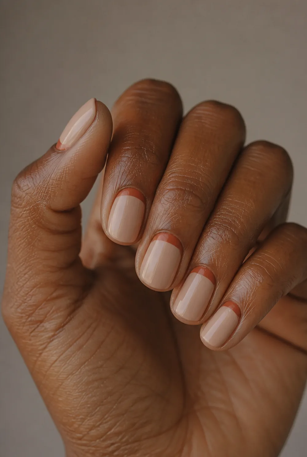 rust half-moons nail art on deep brown skin - PolishedAndPrettyNails.com rust half-moons nail art on deep brown skin