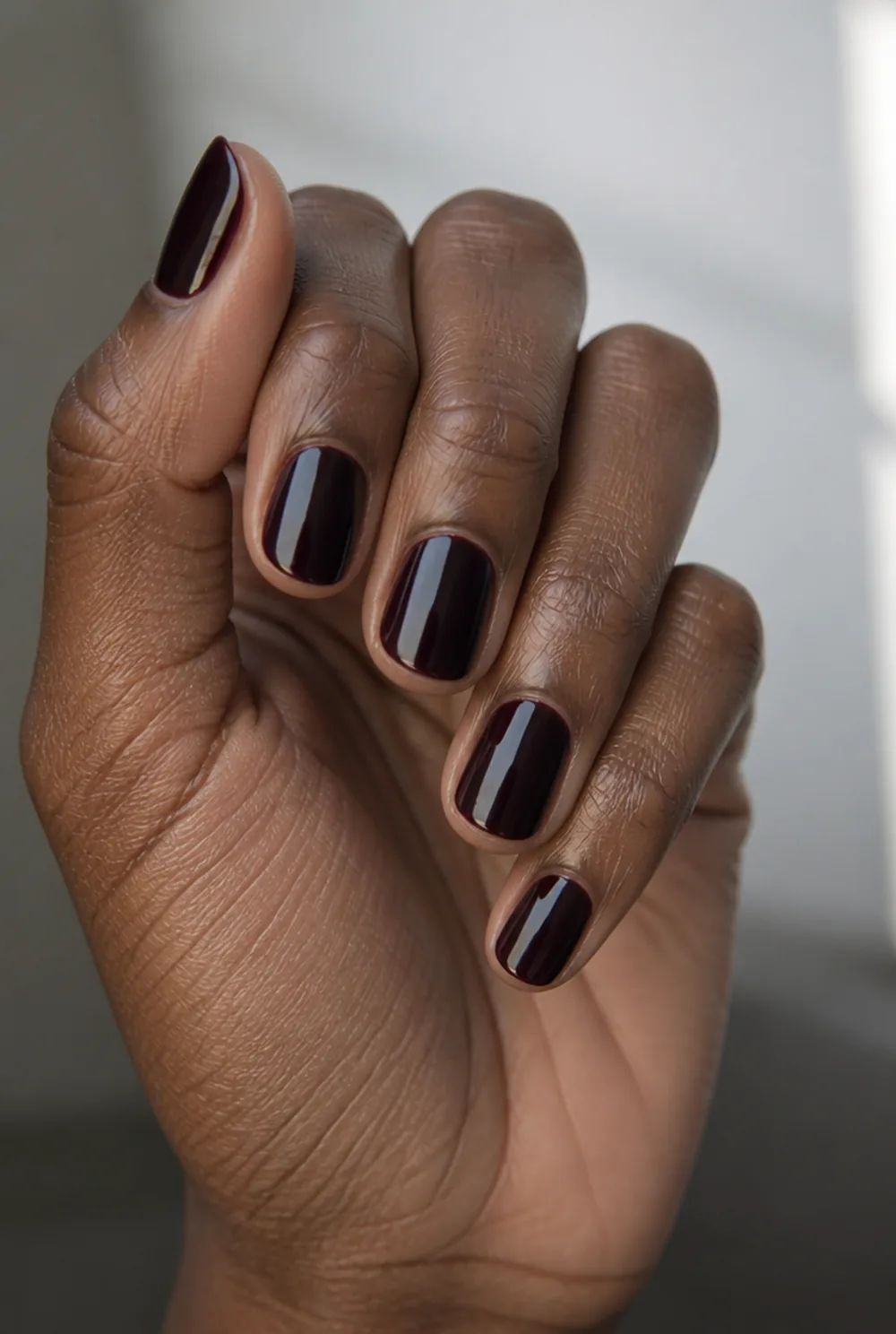 short black cherry nail art on deep brown skin - PolishedAndPrettyNails.com short black cherry nail art on deep brown skin