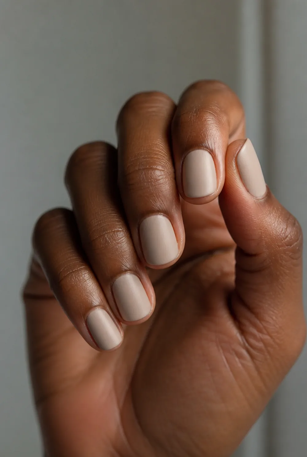 matte neutral nail art on deep brown skin