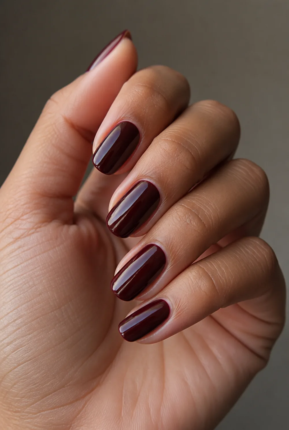 burgundy depth nail art on olive skin, long length