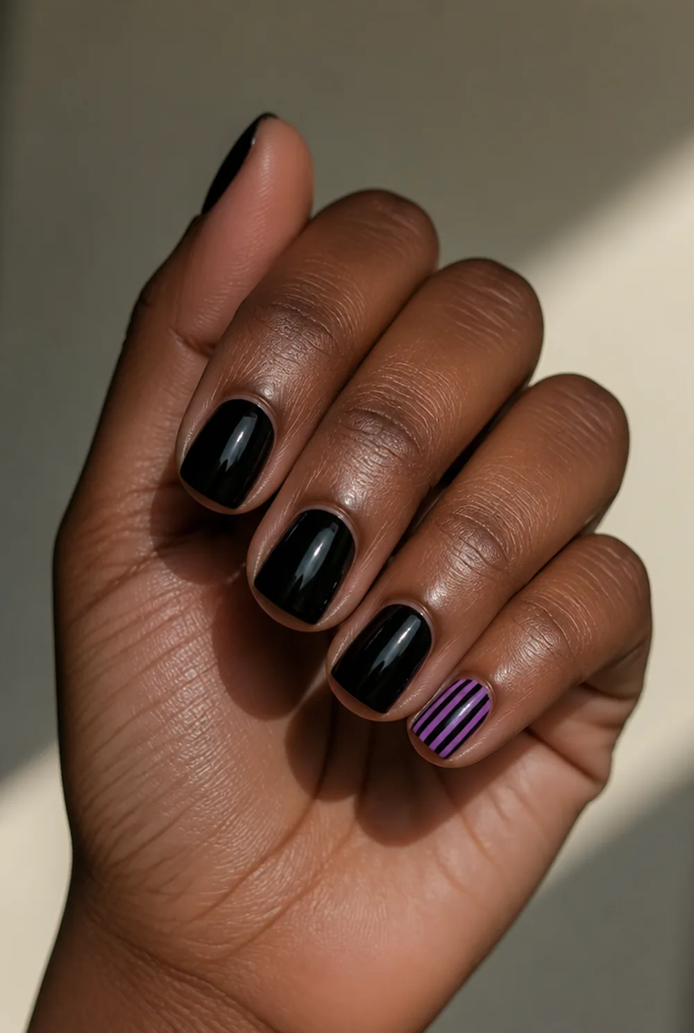 witch stocking pinky nail art on deep brown skin - PolishedAndPrettyNails.com witch stocking pinky nail art on deep brown skin