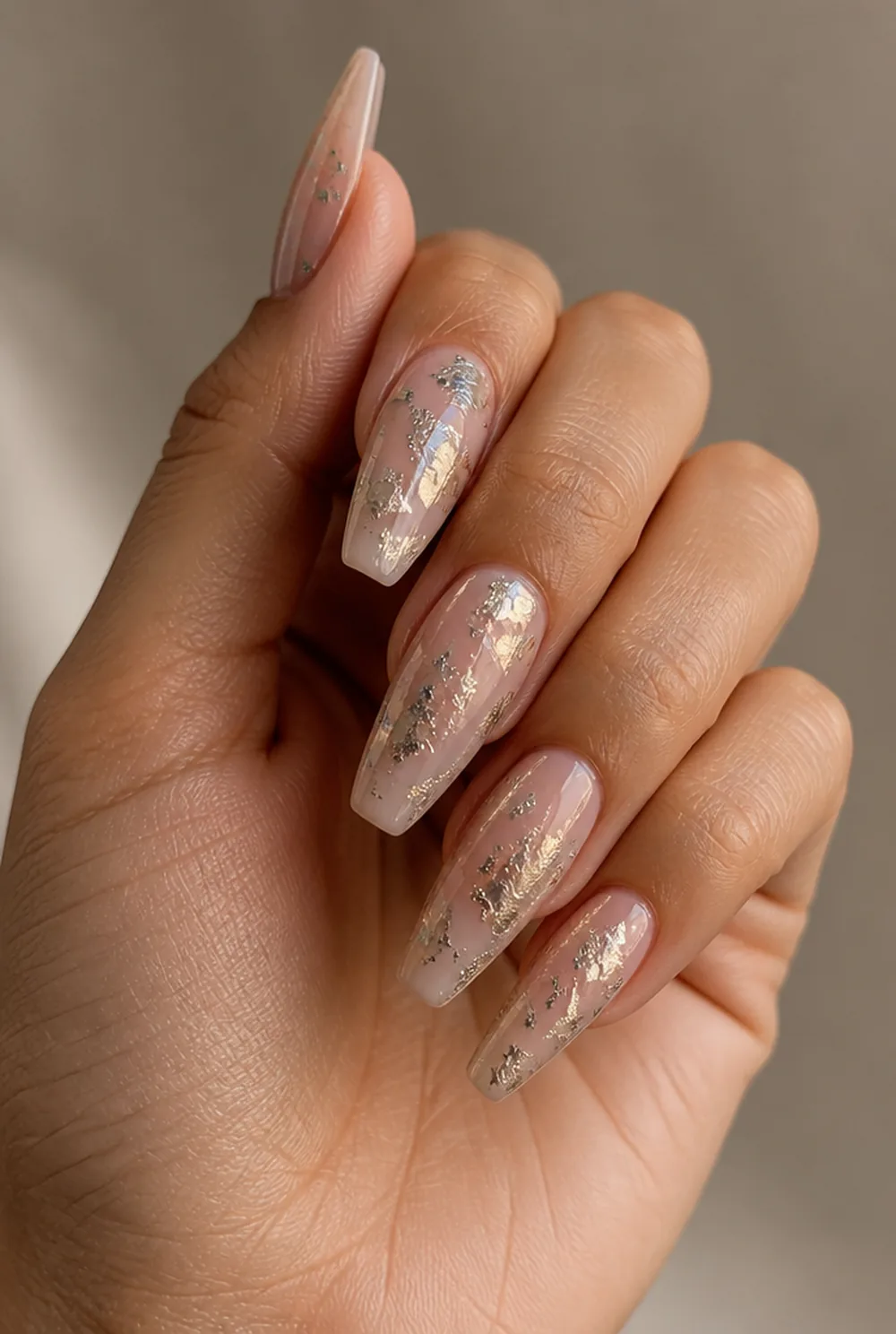foil flakes nail art on olive skin, long length