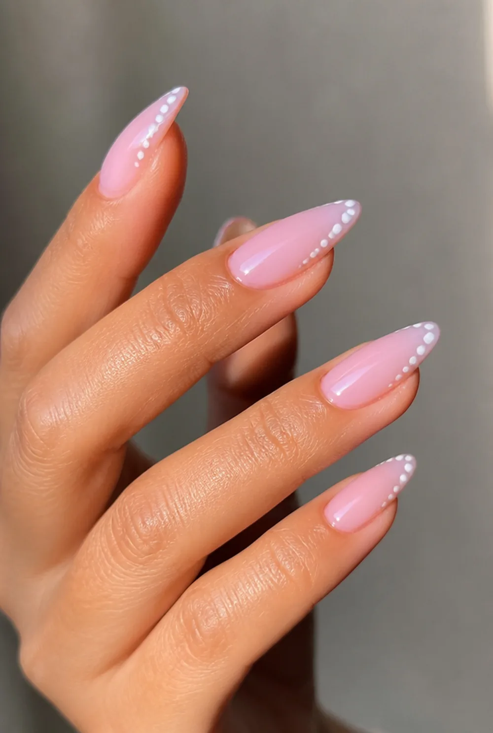 sheer pink and white dot french nail art on olive skin, long length