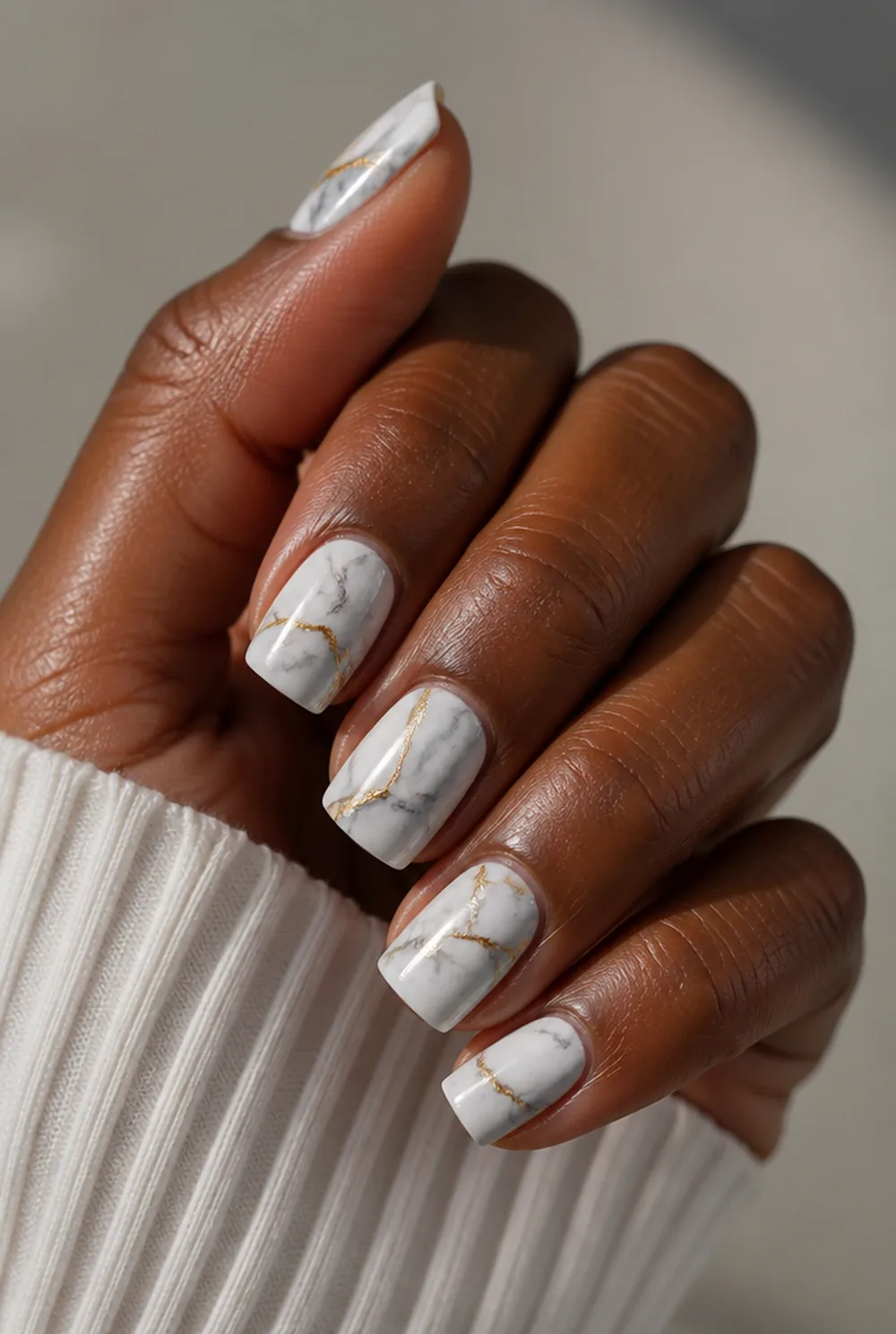 medium square marble nail art on deep brown skin