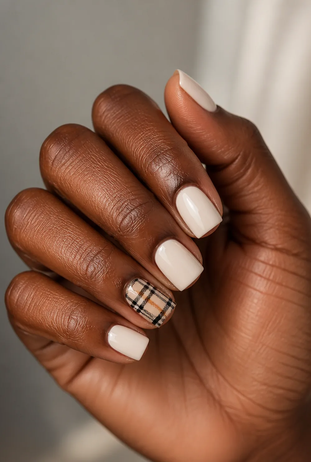 plaid accent square nail art on deep brown skin