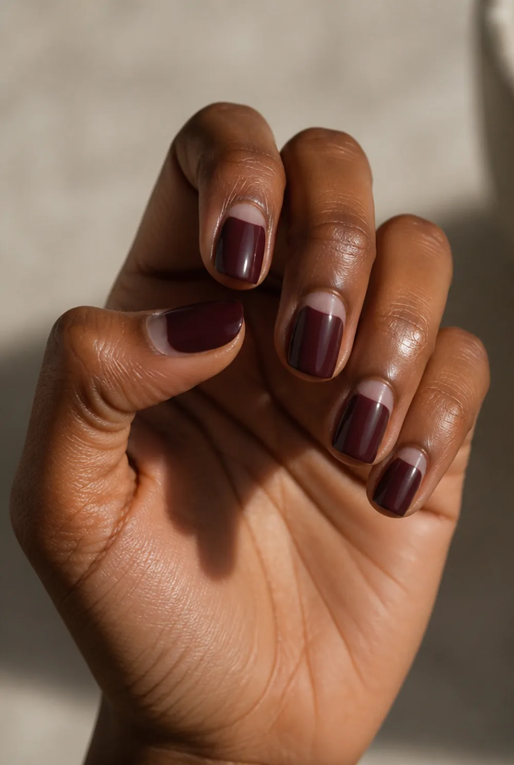 half-moon square nail art on deep brown skin