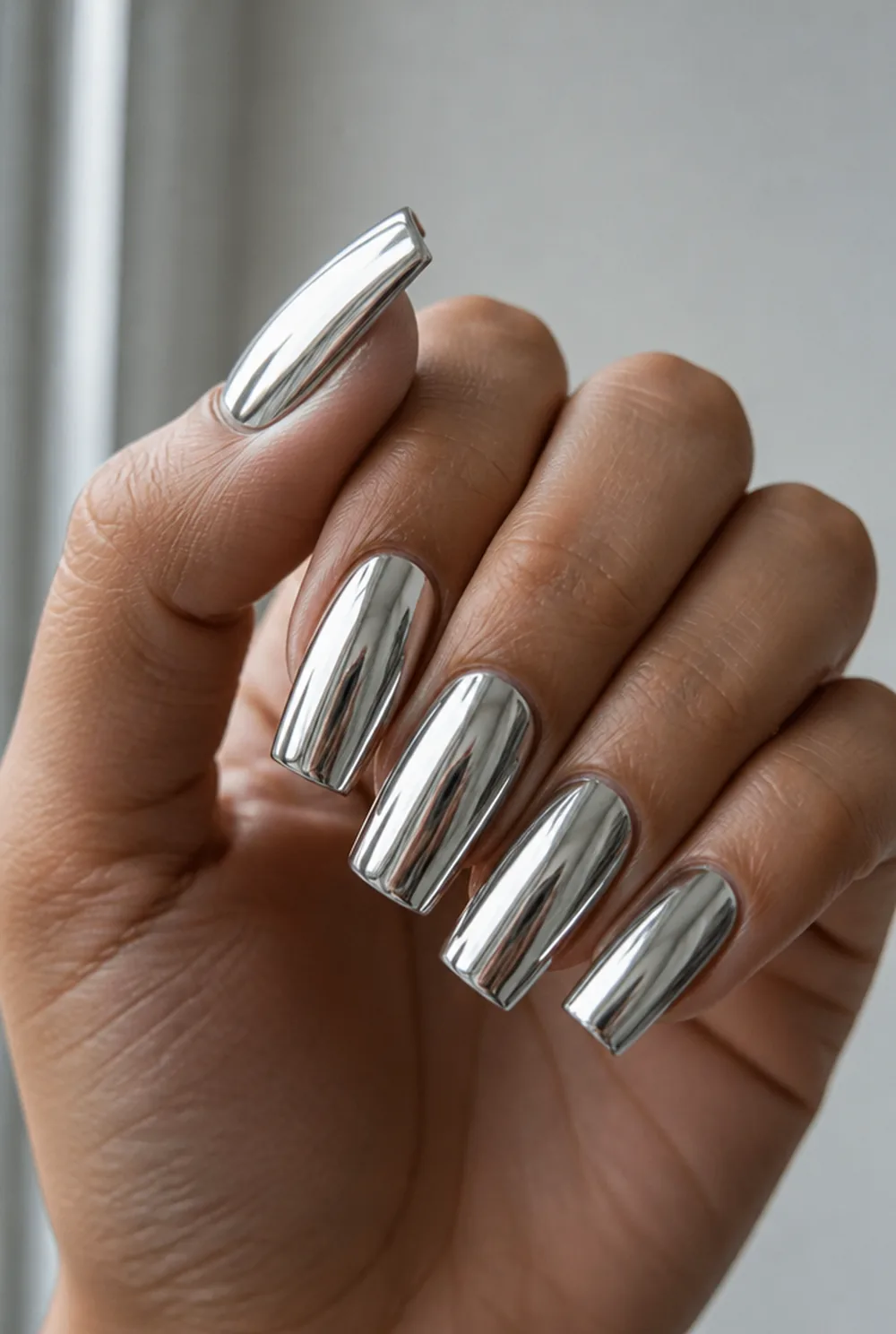 chrome square nail art on olive skin, long length