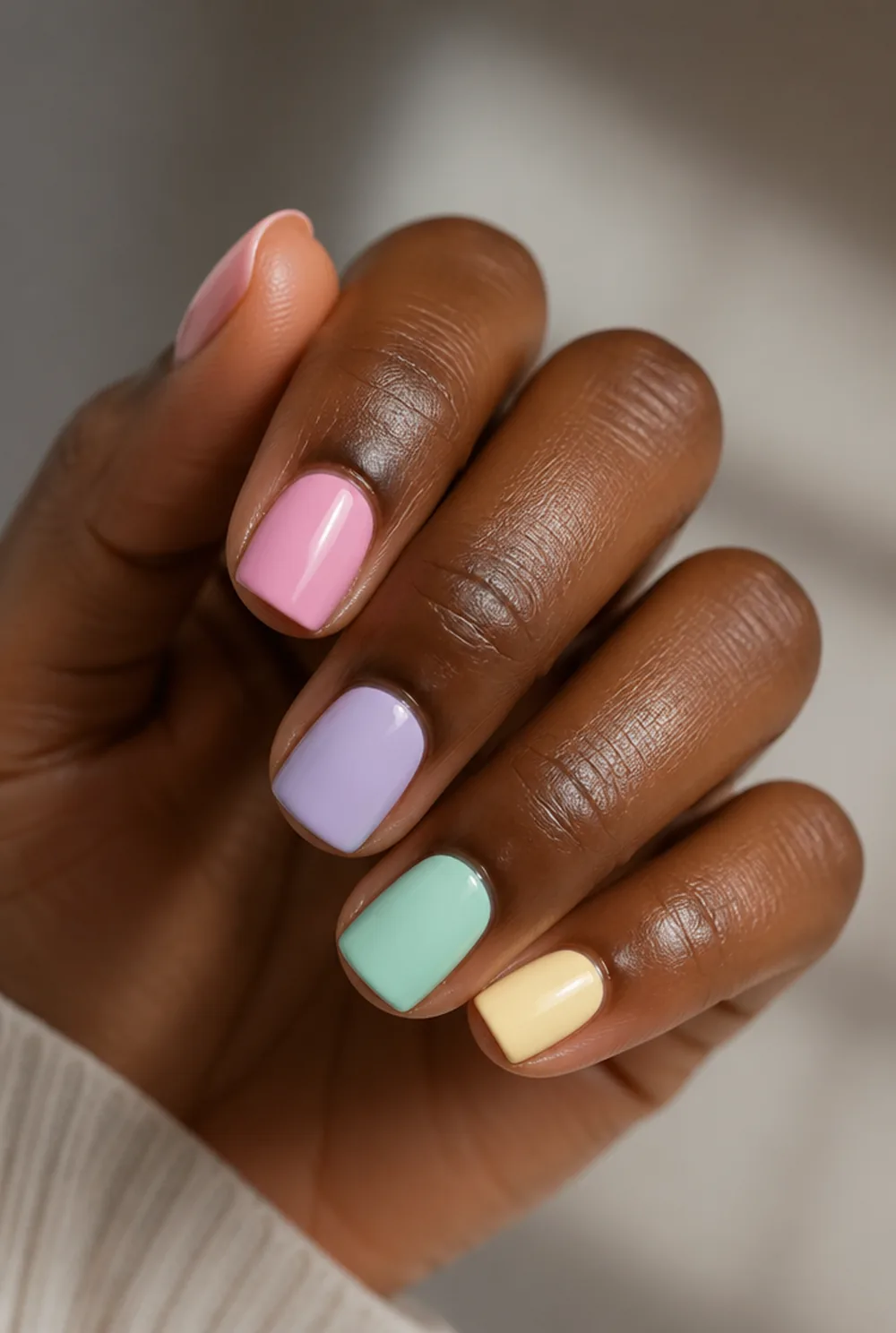 pastel skittle square nail art on deep brown skin