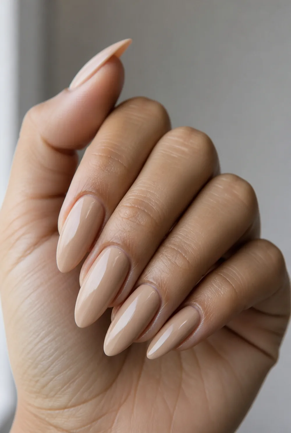 long nude almond nail art on olive skin, long length