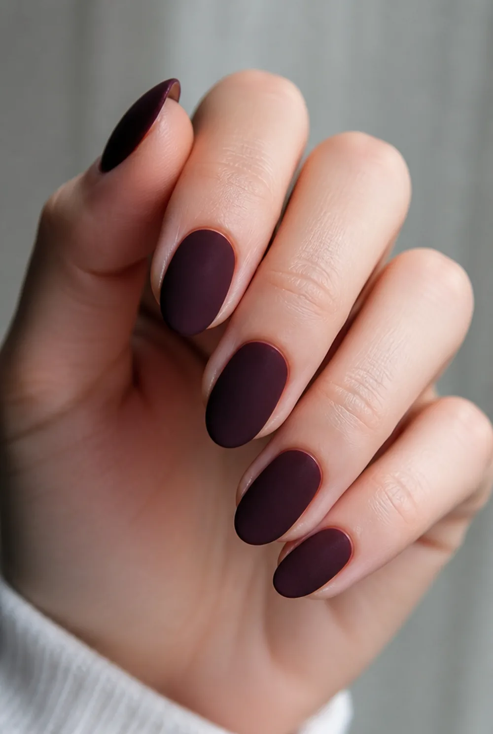 almond velvet matte nail art on fair skin, short length