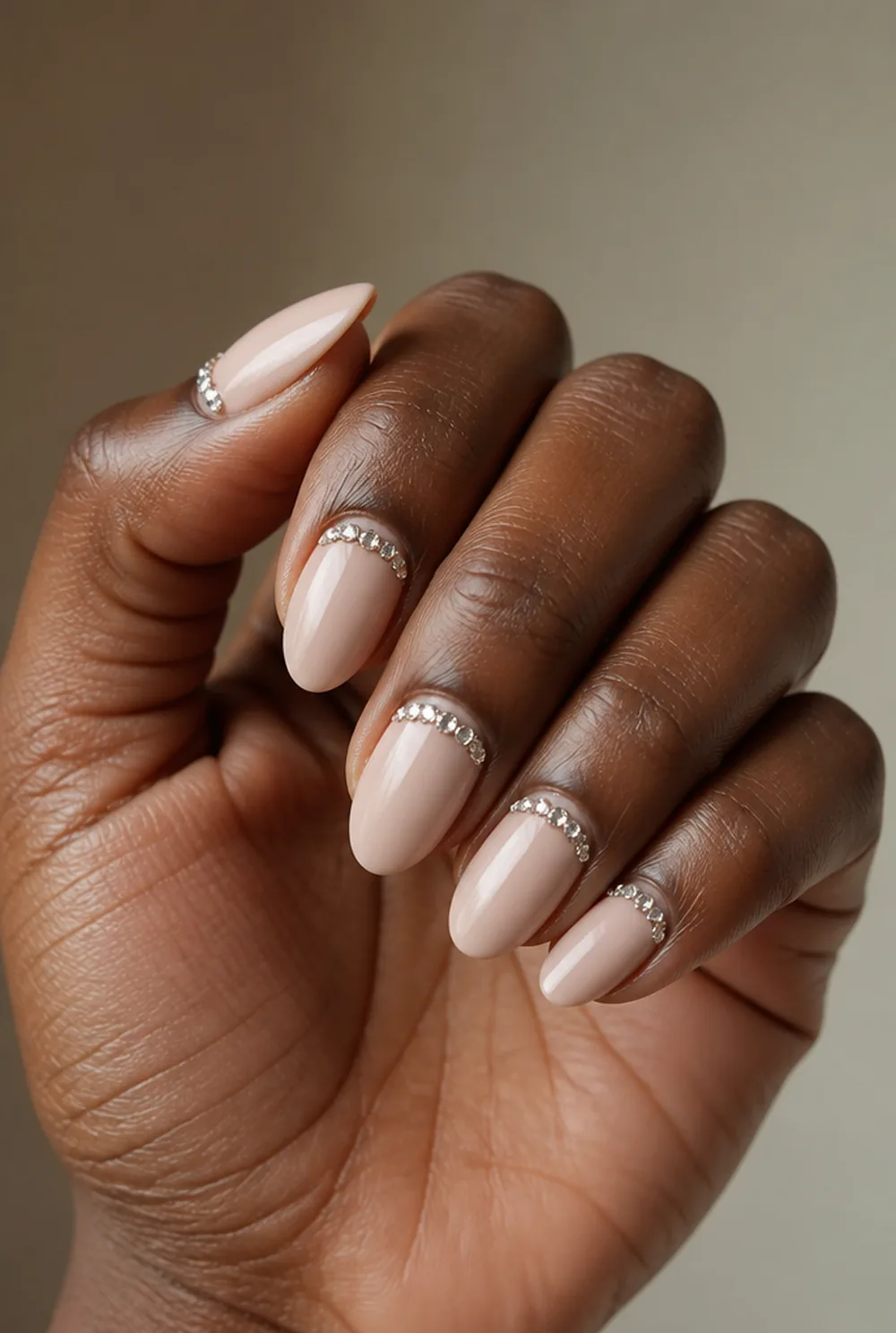 almond with rhinestone cuff nail art on deep brown skin