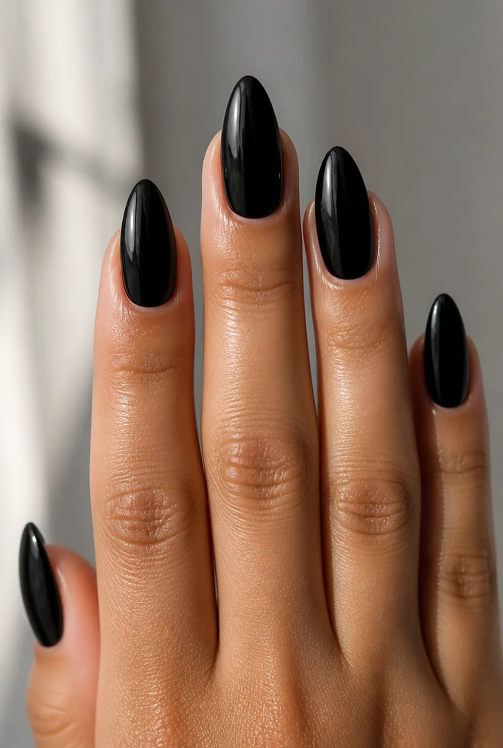 almond black gloss nail art on olive skin, long length