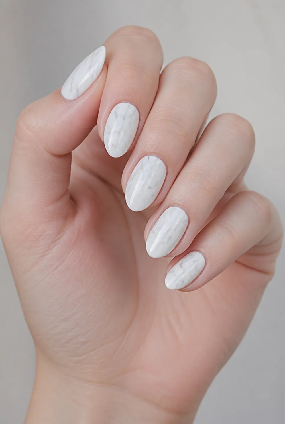 almond marble nail art on fair skin, short length