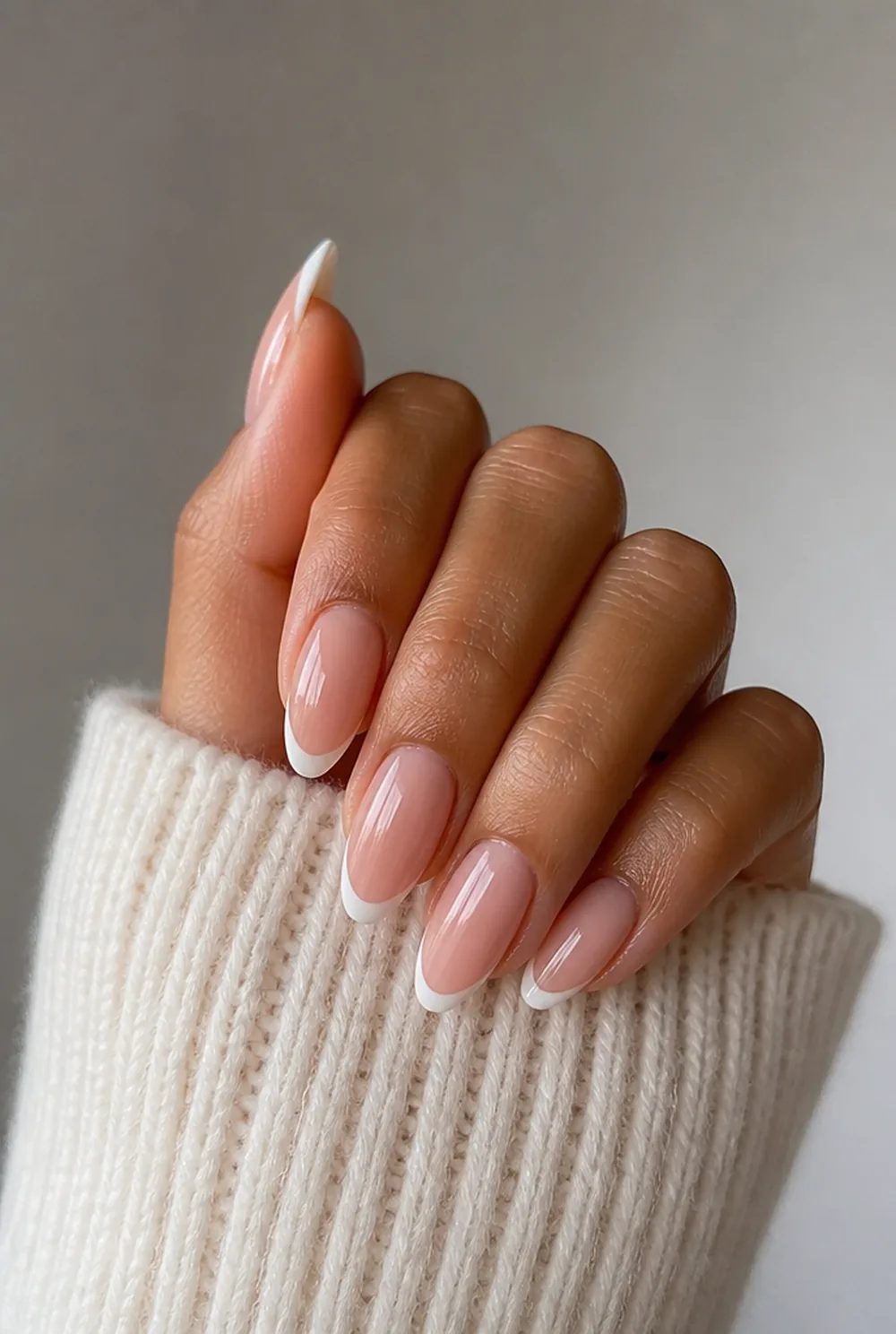 almond french tip nail art on olive skin, long length