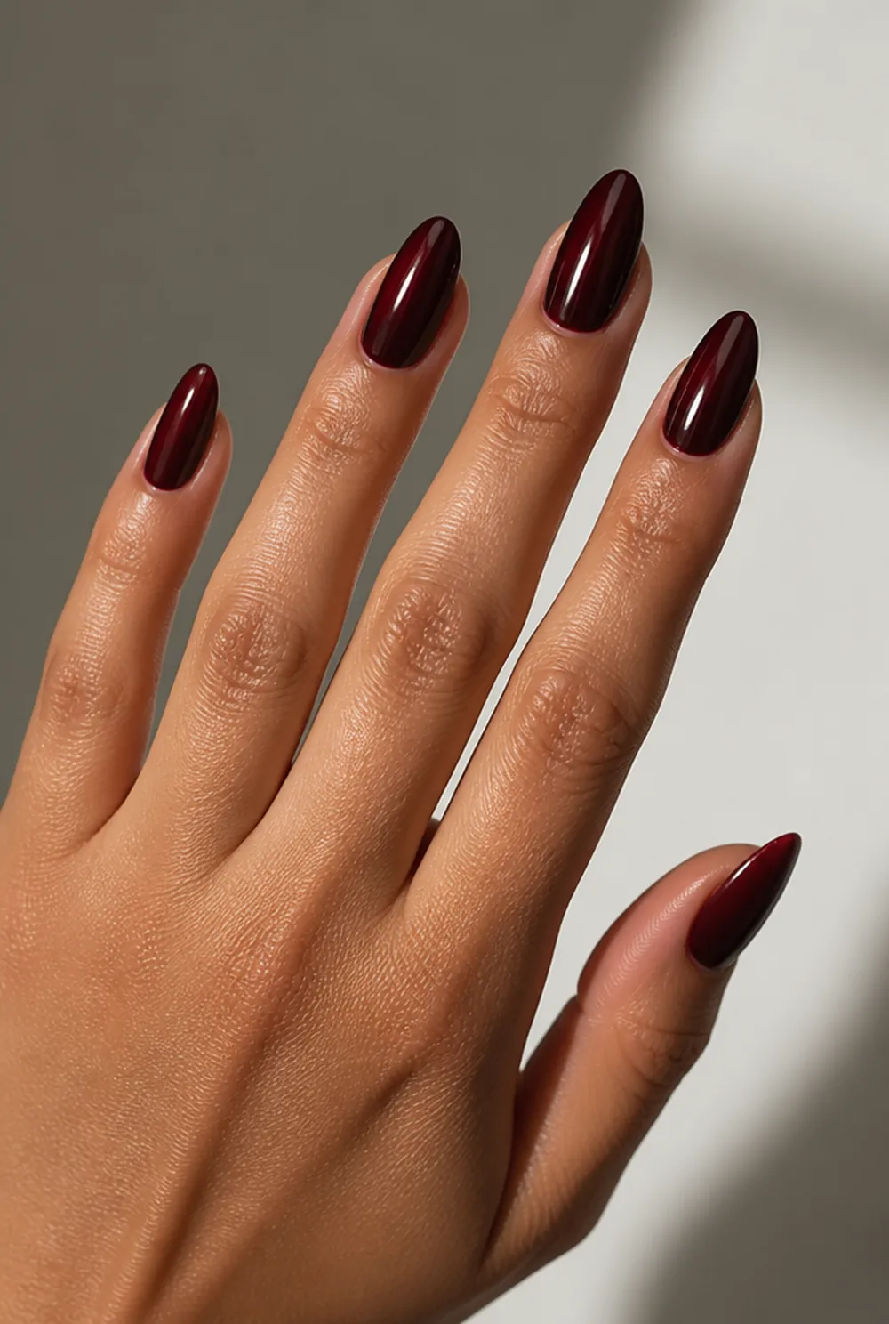 blackened cherry almond nail art on olive skin, long length