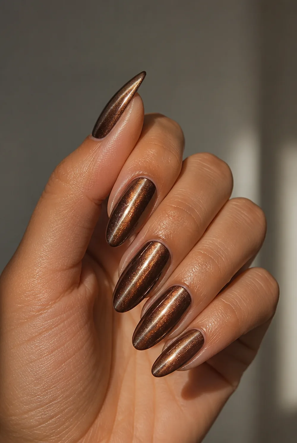almond cat eye nail art on olive skin, long length