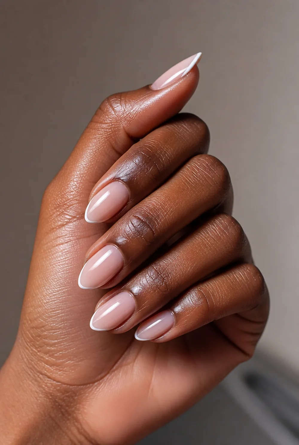 almond with micro french nail art on deep brown skin