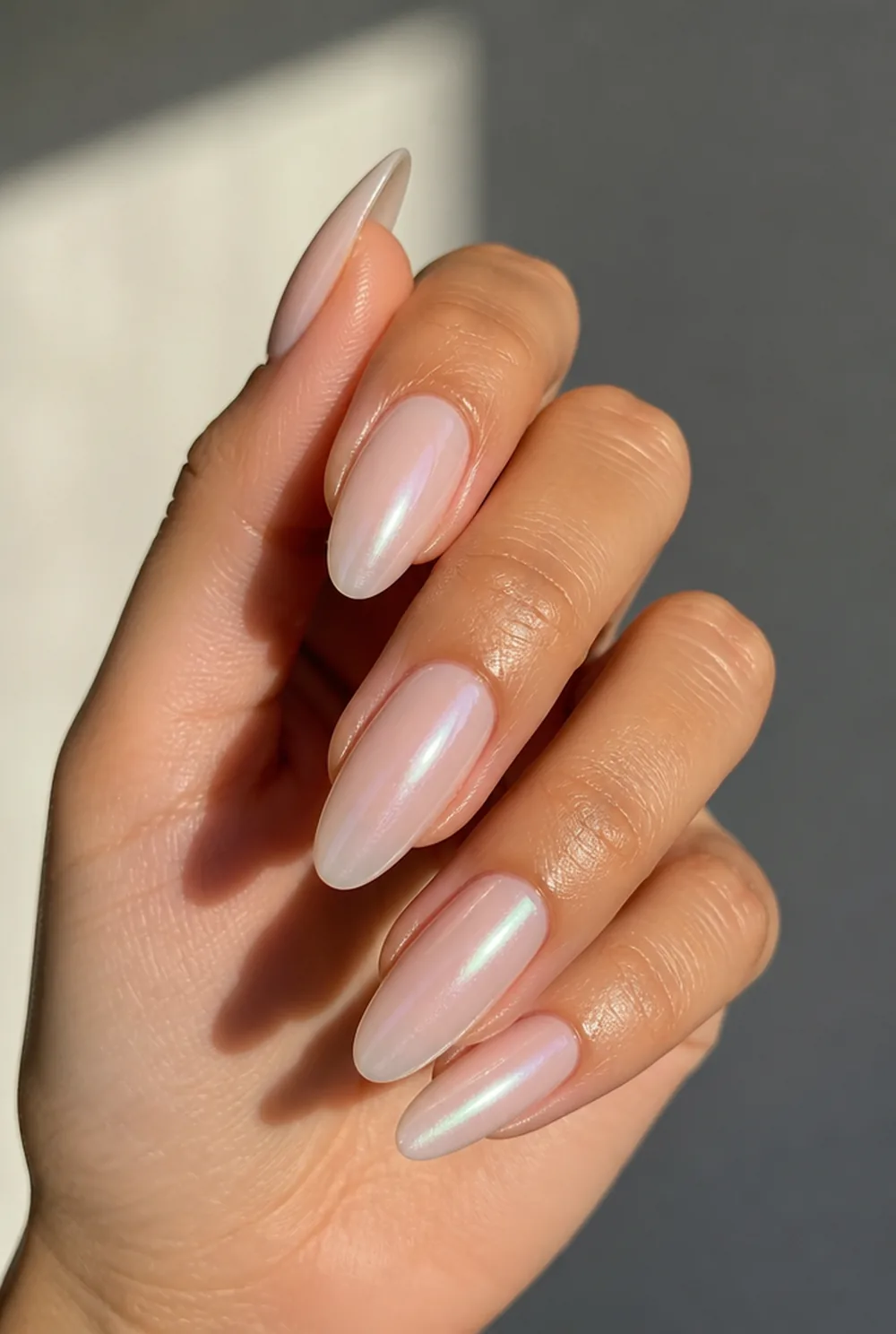 almond glazed pearl nail art on olive skin, long length