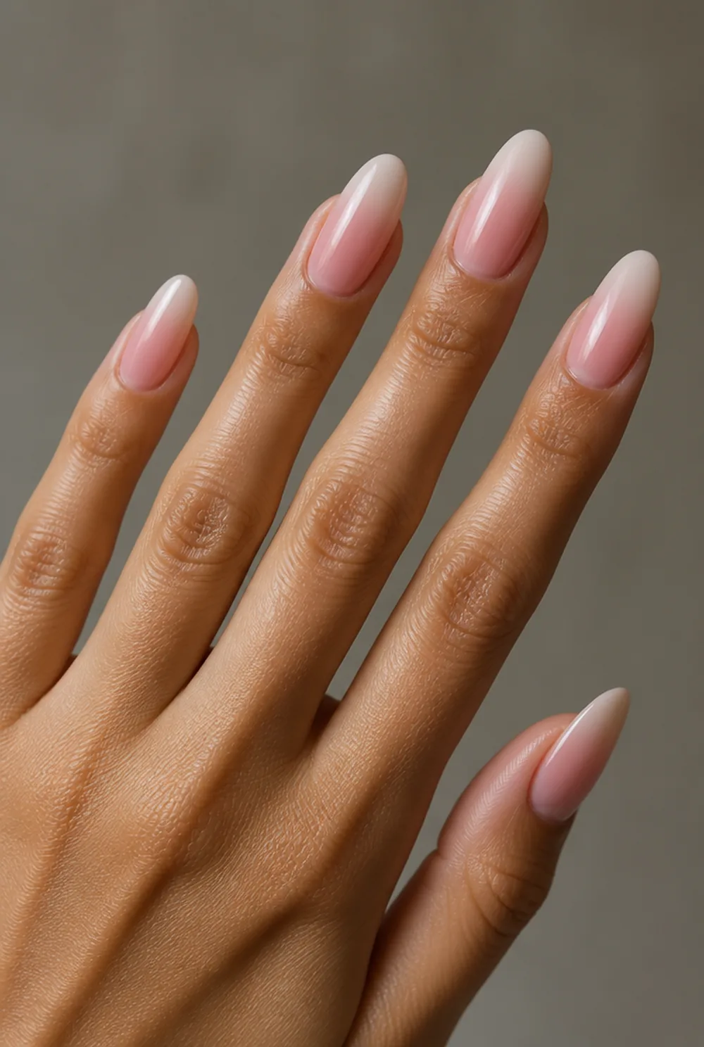 pink aura on nude nail art on olive skin, long length