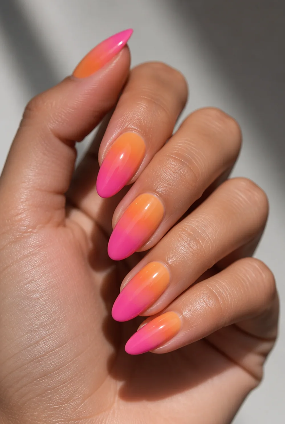 orange sunset aura nail art on olive skin, long length