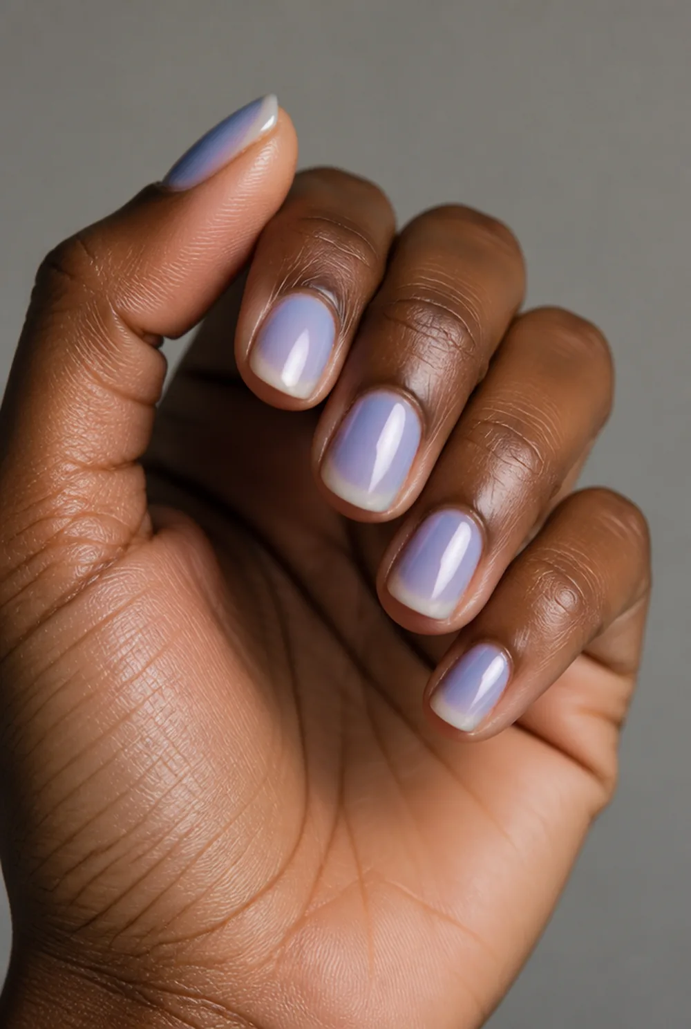 blue aura nail art on deep brown skin