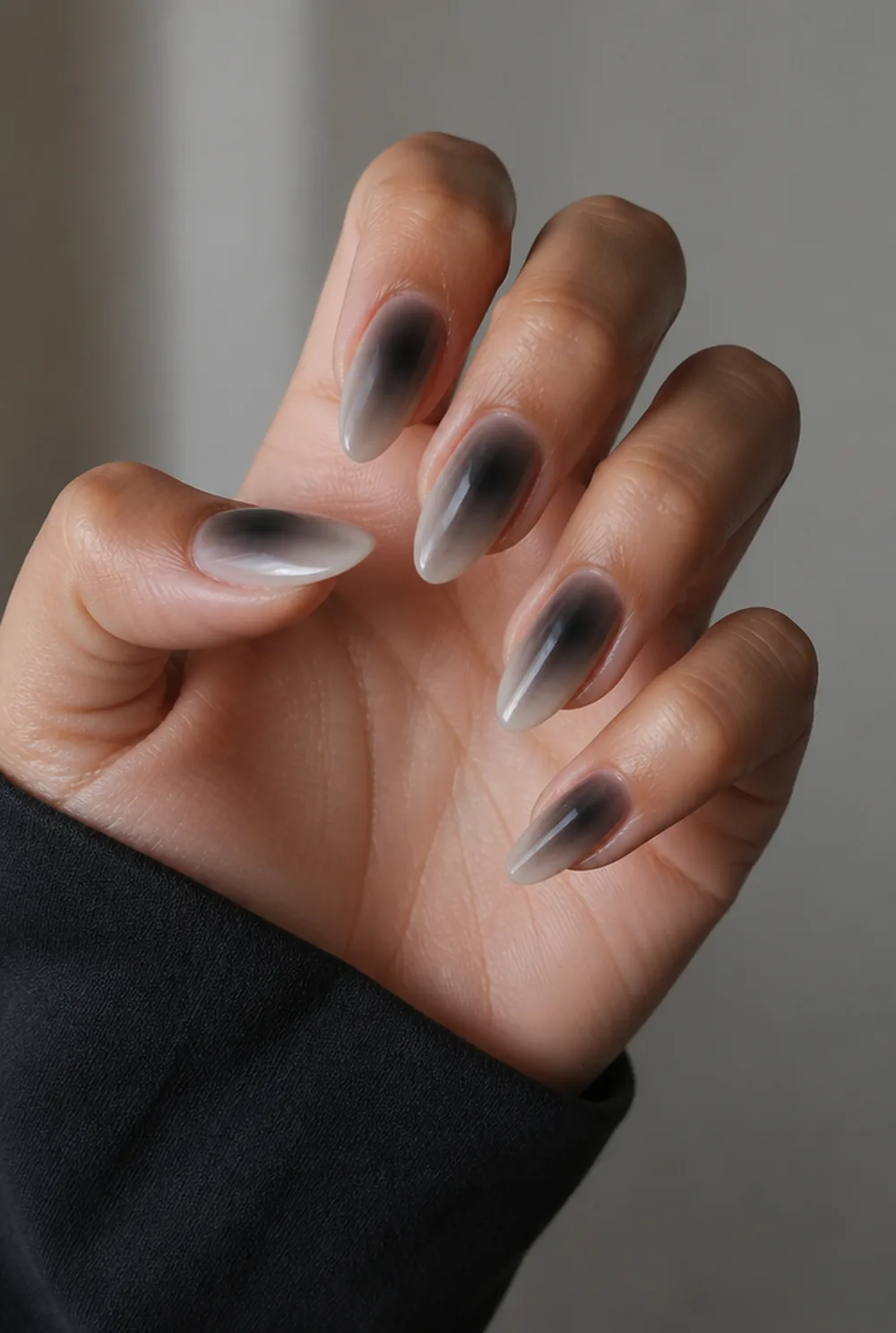 black aura nail art on olive skin, long length
