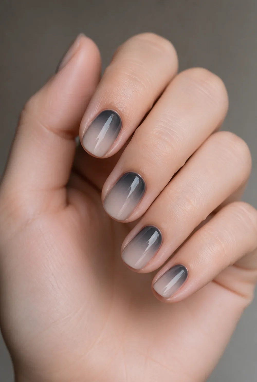 black aura nail art on fair skin, short length
