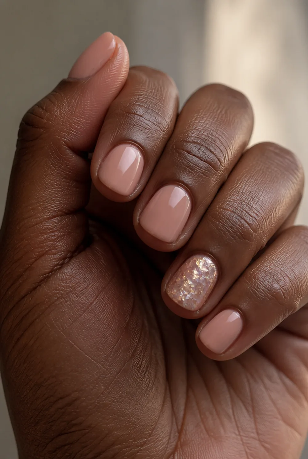 disco ball accent nail art on deep brown skin
