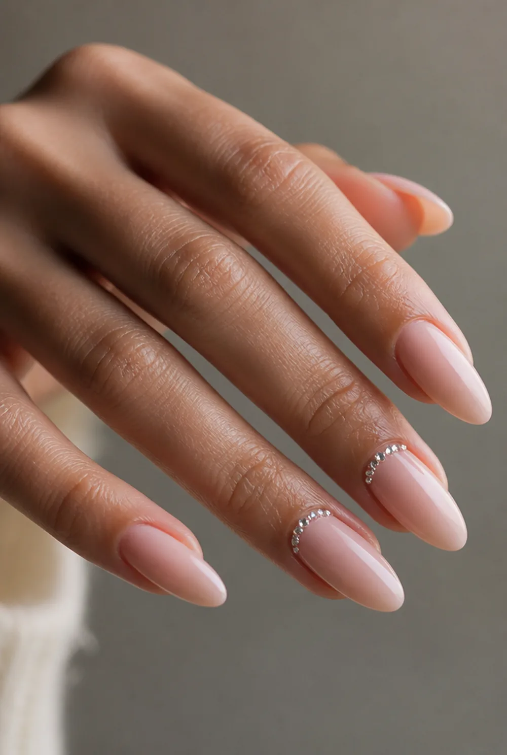 rhinestone cuff nail art on olive skin, long length