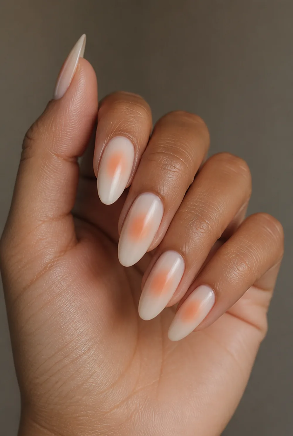 soft aura nail art on olive skin, long length