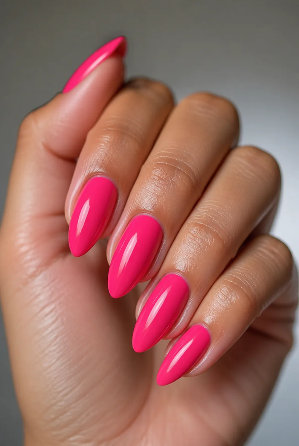 hot pink gloss nail art on olive skin, long length