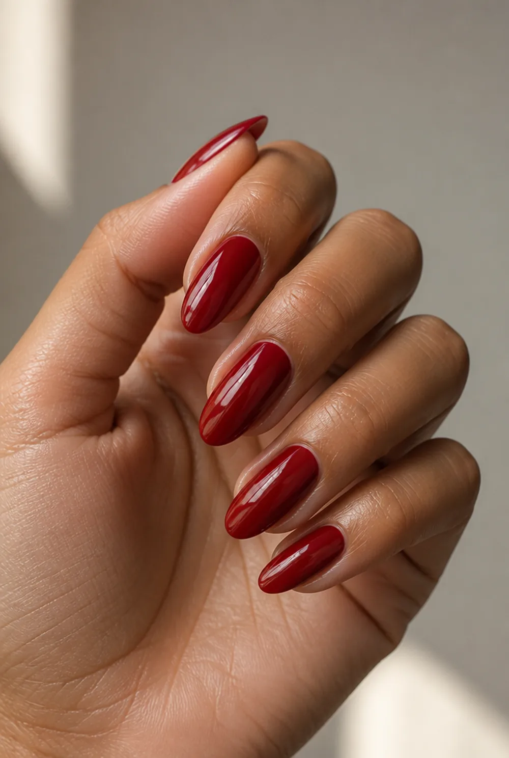 cherry red nail art on olive skin, long length