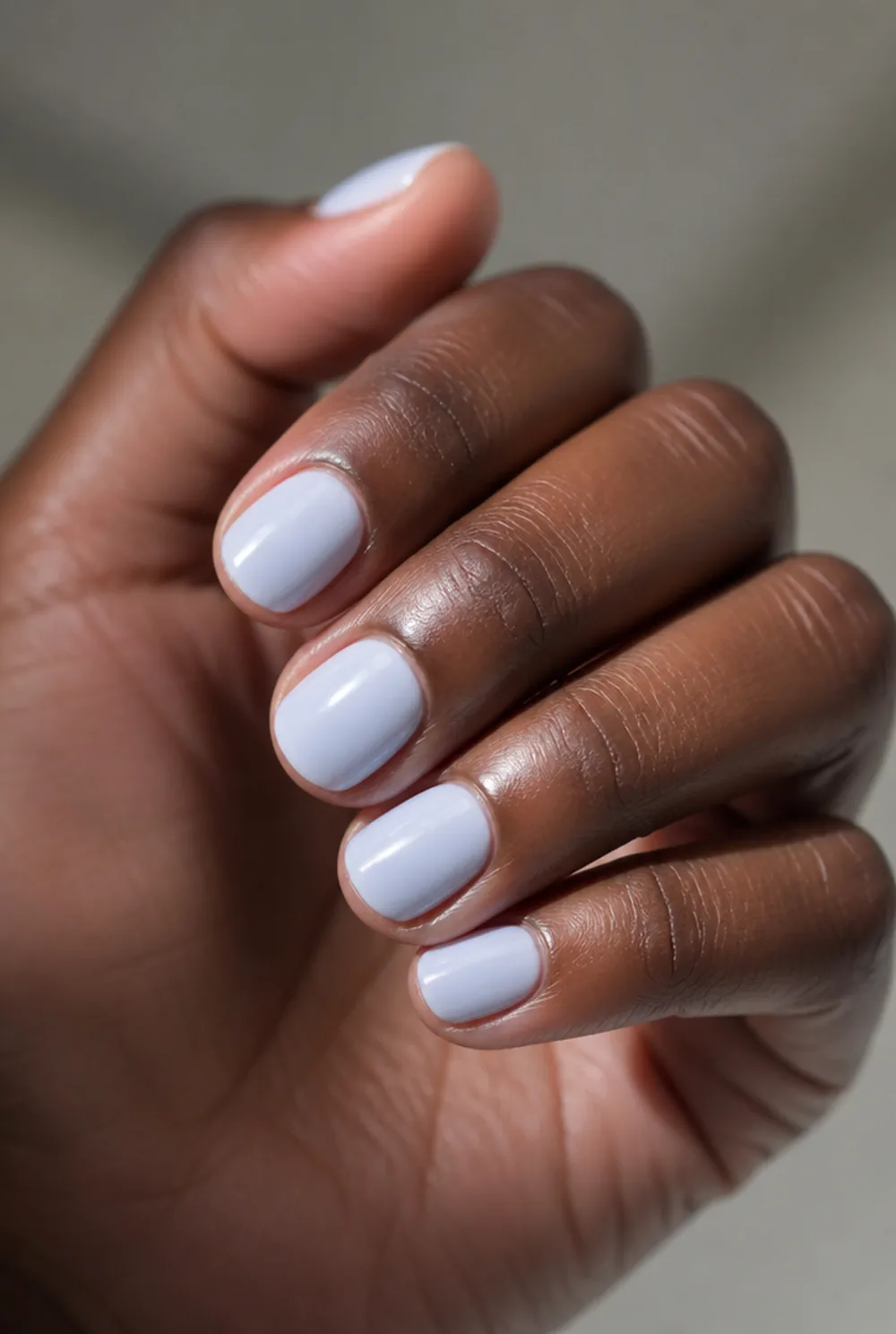 baby blue milky nail art on deep brown skin